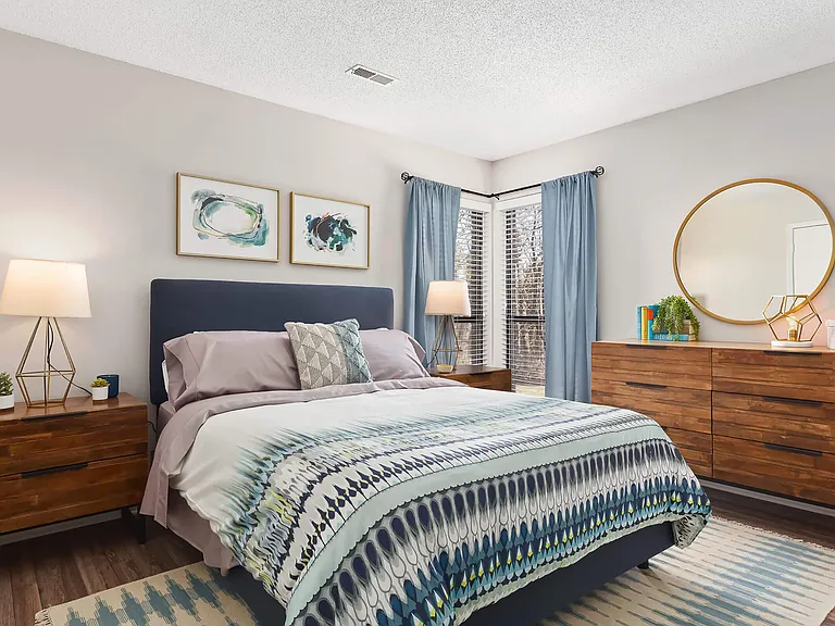 Bedroom with Accent Wall and Large Windows Bringing in Natural Light - Diamond Interior