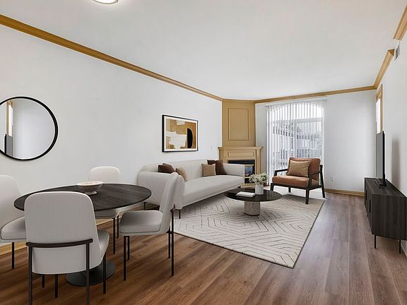 Renovated Package I dining and living room with hard surface flooring