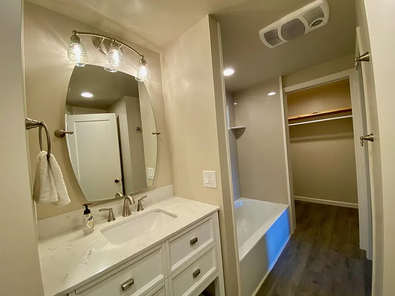 Bath looking into the walk in closet