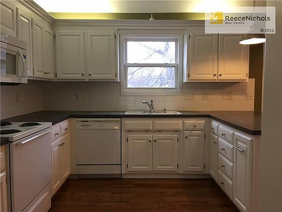 Large Kitchen, Pantry Cupboard, Microwave, Electric Range, Dishwasher and Refrigerator.  Newly refinished Cabinetry.