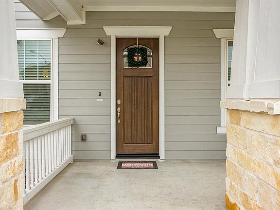 8 ft. Front door is a great starting point into this home
