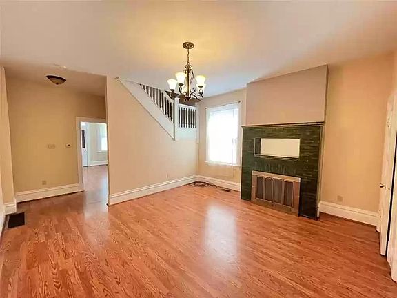Living room will be painted a light sage green and all trim freshly painted white. A new chandelier will be installed.