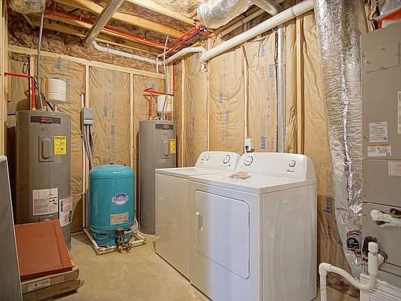 Full size washer and dryer in downstairs utility room.