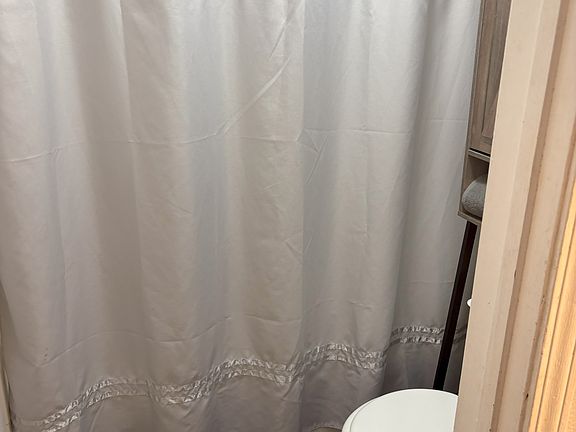 Door separates the toilet/shower/bath room so 2 people can easily get ready at the same time.