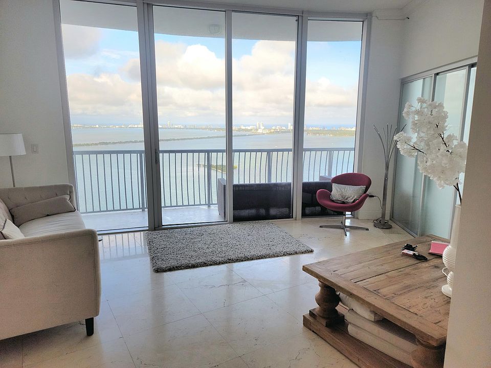 As soon as you walk in, you have picturesque views of the entire Miami Beach skyline. Seen here are your views from dining, living room, and kitchen.