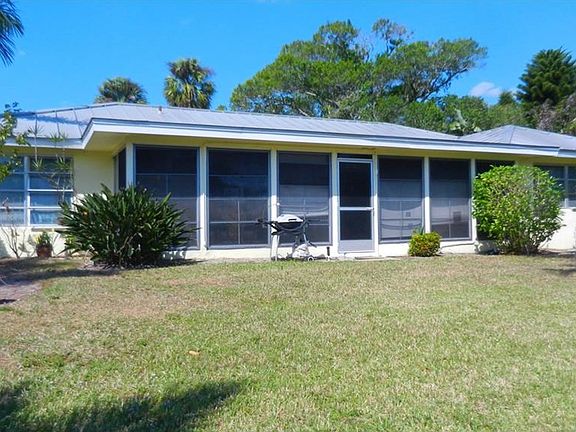 Rear of house showing enclosed lanai.