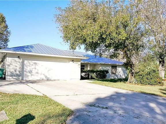 This home has a brand new metal roof, new air conditioning system and large driveway with an area to park your boat.