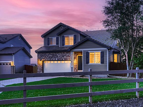 Large front yard by open space.
