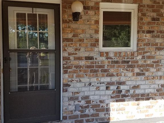 Storage closet, front door and kitch window