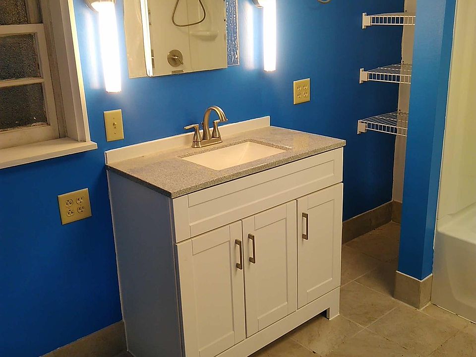 Basement bathroom with heated tile floor viewed from the doorway.