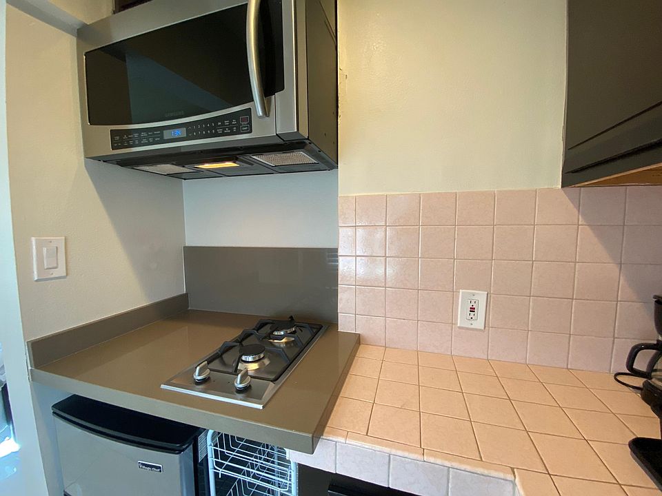 The microwave above the cooktop is also a traditional oven.
