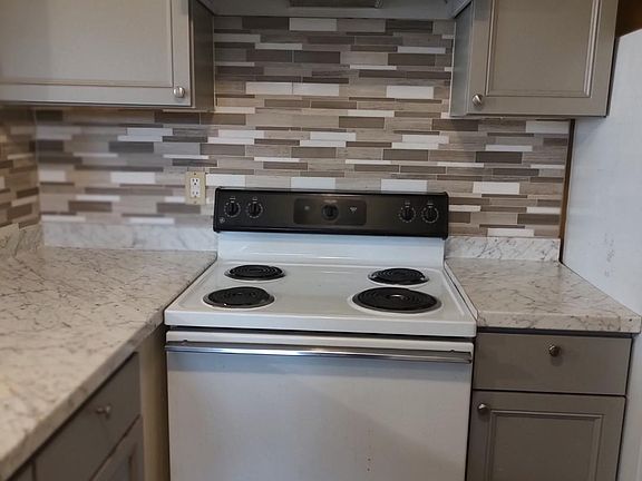 Beautiful cabinets and full wall backsplash