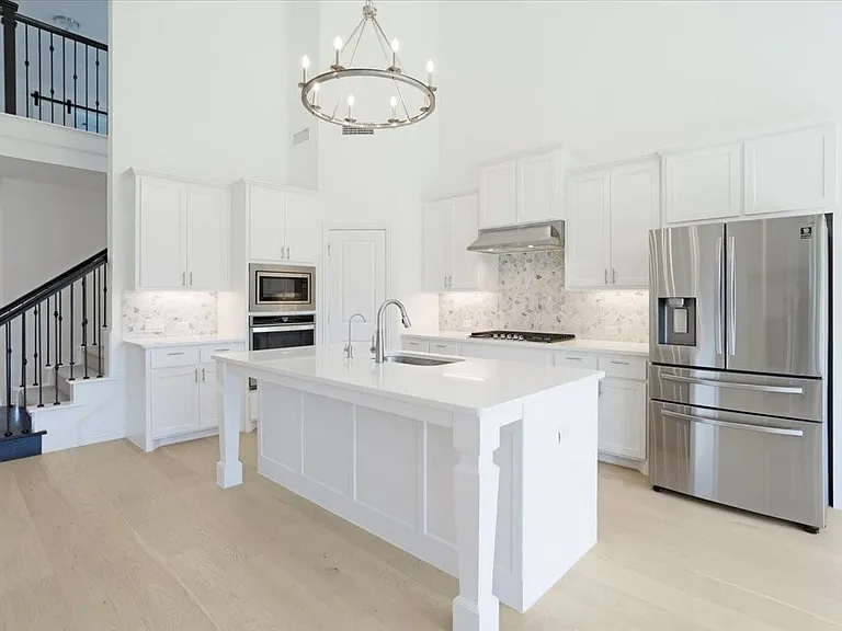 Kitchen island with seating and prep space.