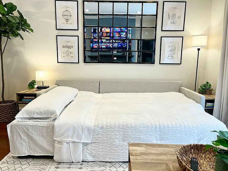 New Pottery Barn slipcovered sectional that converts to a king bed for an extra guest.