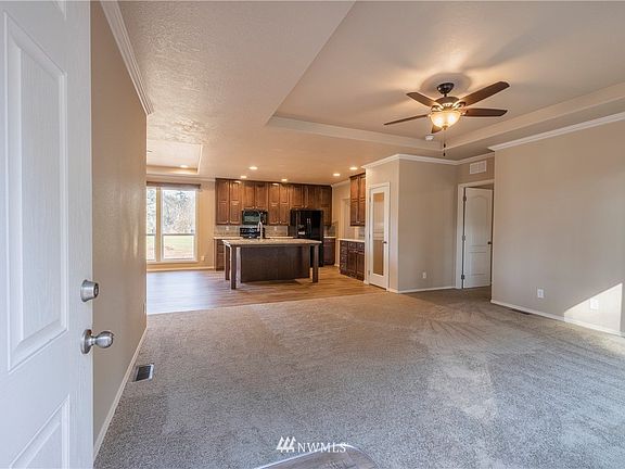 From the front entrance you will enter your open living room with coffered ceiling.