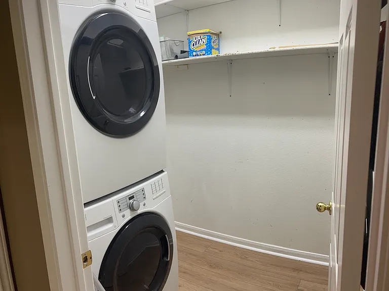 Door to laundry is conveniently location next to main floor living room and across from the main floor bedroom.