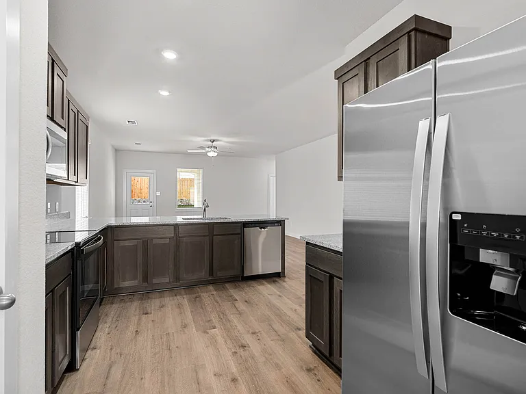 The kitchen has stainless-steel, energy-efficient appliances.