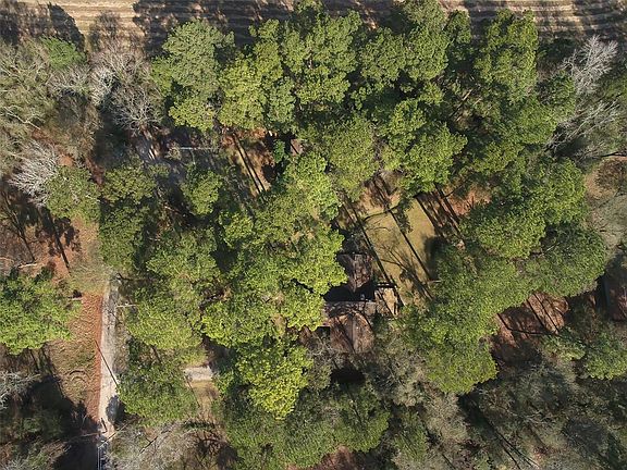 The vacant lot is adjacent to an improved property that is also for sale separately.