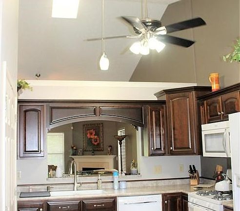 A view of the kitchen showing how high the ceiling soars.