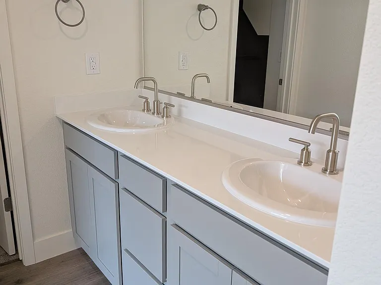 Double sink vanities upstairs and master with walk-in shower