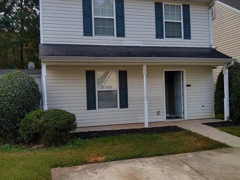 Two car parking pad. Front yard.