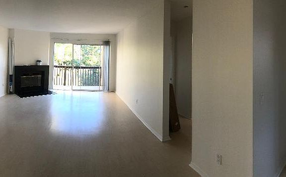 Entrance, living room and part of kitchen.