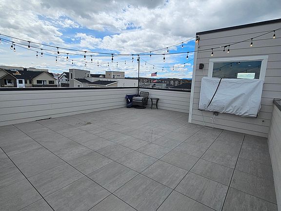 Huge 26' x 21' rooftop deck with included TV begging to entertain family and friends