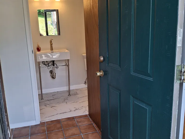 New Powder room near front entrance and Living Room