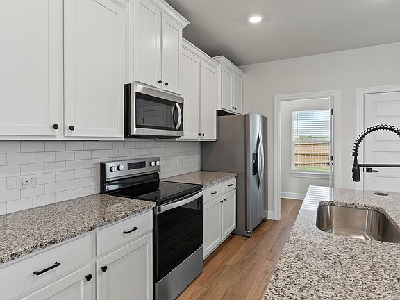 The kitchen has sprawling countertops.