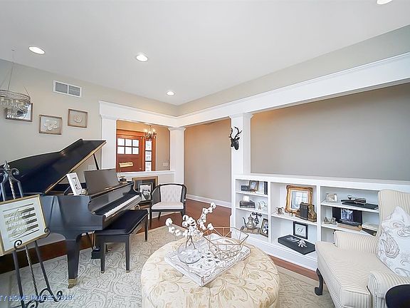 Formal Living Area in the front of the home.  Built in display shelves, Hardwood flooring.