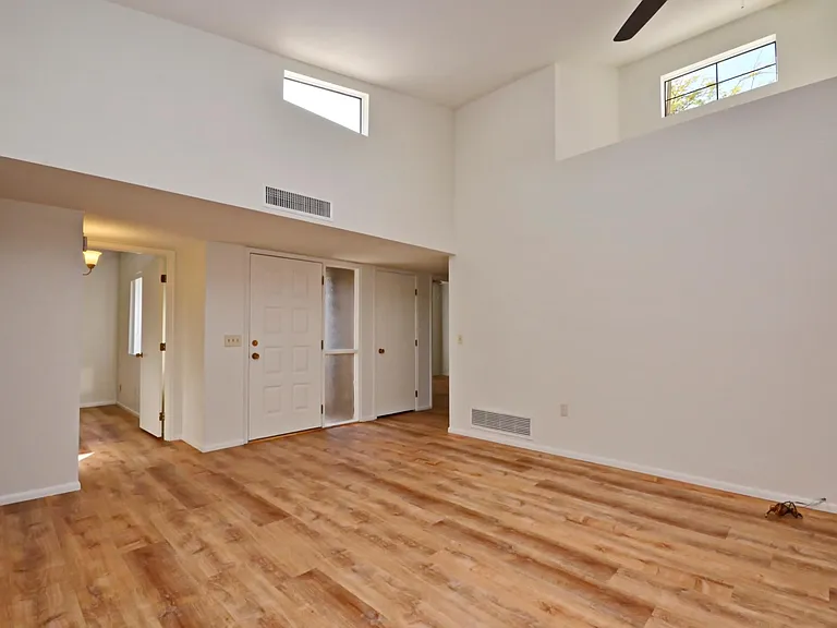 Light and bright living room view to entrance.
