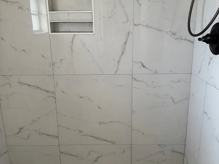 __ Primary Bathroom
"Beautifully remodeled bathroom featuring a walk-in tile shower, modern fixtures, and fresh finishes."