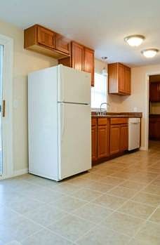 Brand new galley style kitchen (11x9) features new oak cabinets, ceramic tile flooring, new counter tops, and mostly all new appliances.