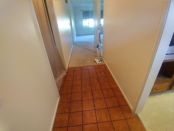 Entryway with a hallway closet