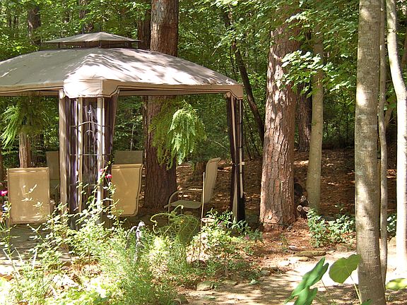 gazebo in wooded backyard