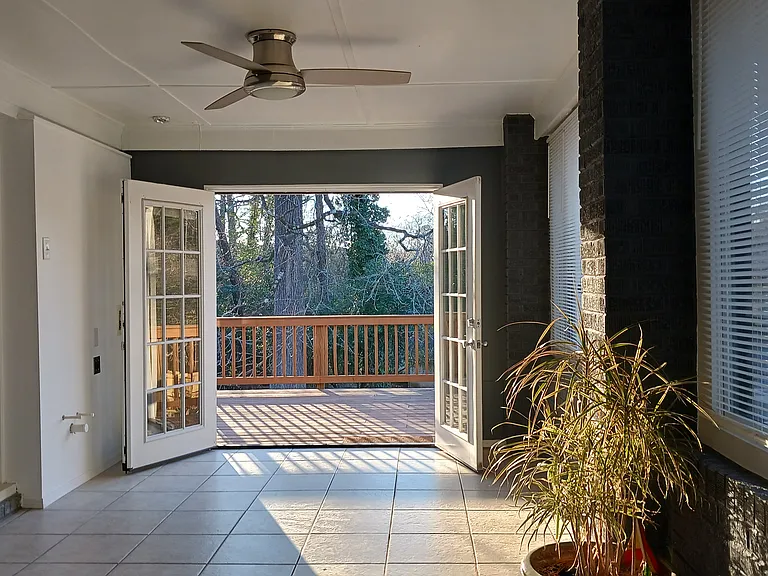 The bonus room off the kitchen opens onto the back deck.