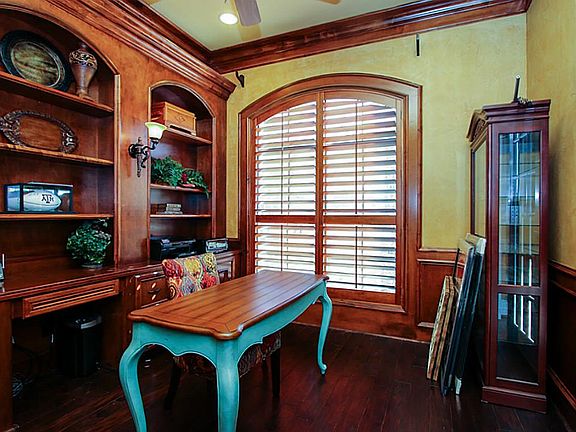 Study has built ins with french doors