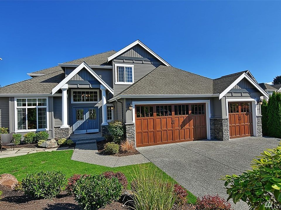 Tons of updates and modernizations to this 4 or possibly 5 bedroom home. Features include double door entry, A/C and the gorgeous new high end aluminum (wood inspired) garage doors from Northwest Doors. Front patio addition provides additional seating areas with a low maintenance yard.