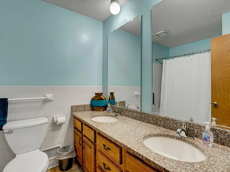 Main bathroom with shower/tub combo.