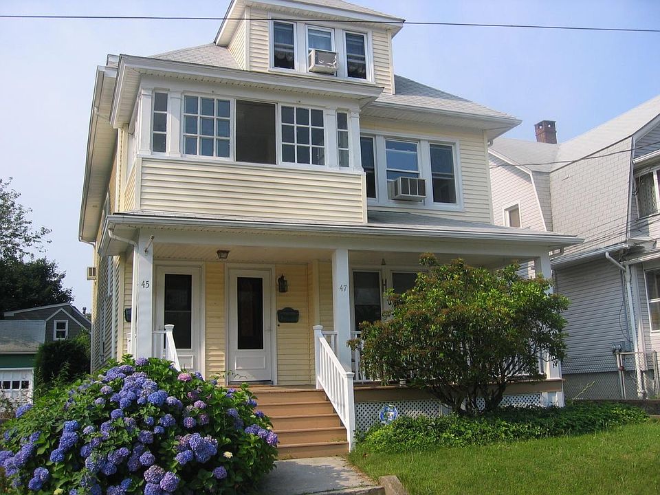 Front of house. The door on lef, #45 leads up to the second 