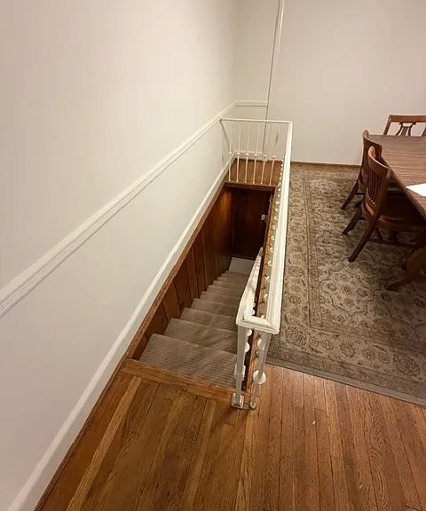 Approach to the lower level. where is a living/media/recreation/guest room and a full bathroom