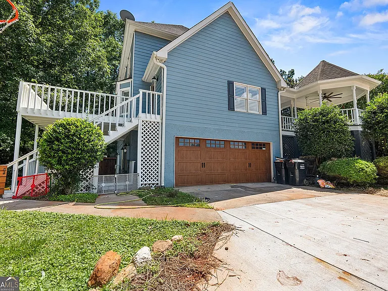 Attached two-car garage with access to basement and backyard.