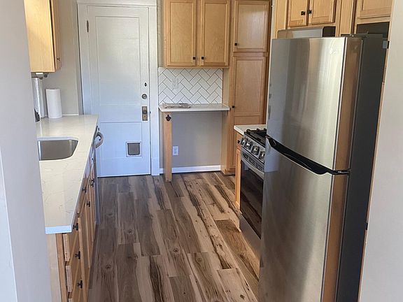 Kitchen, taken from small mud room area.