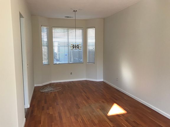 living room downstairs w/ bay window