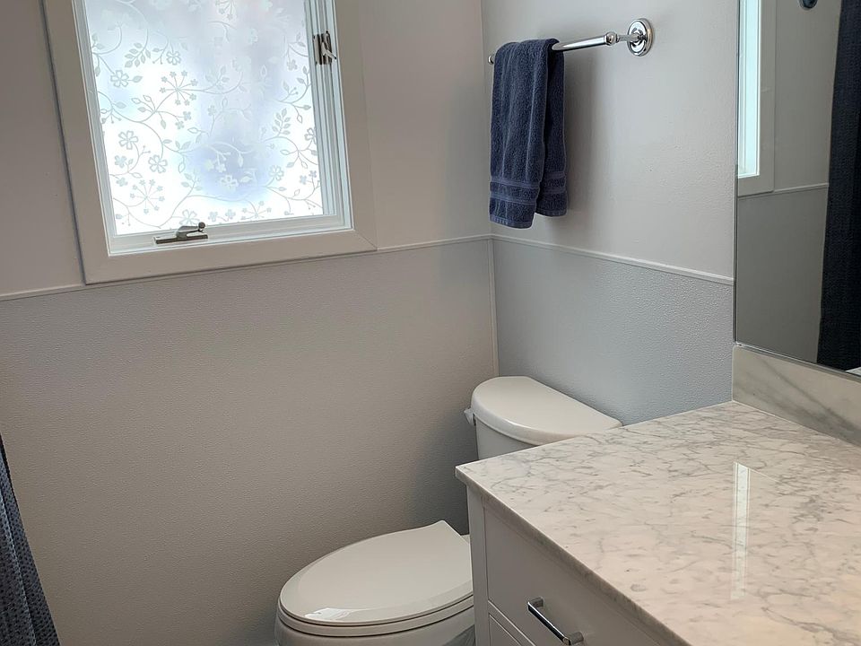 New, high end (Toto) toilet and marble counter top