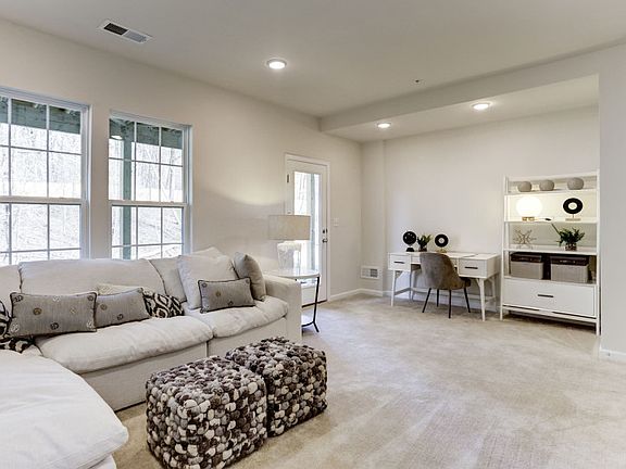 Model Representation - First Floor Carpeted Game Room with a Door to the Rear Yard