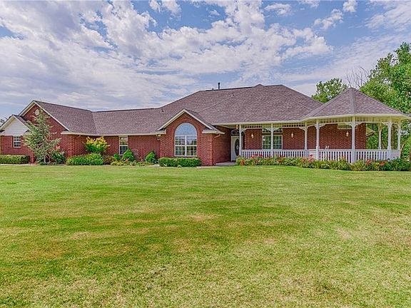 Another front view of the house showing large porch with gazebo