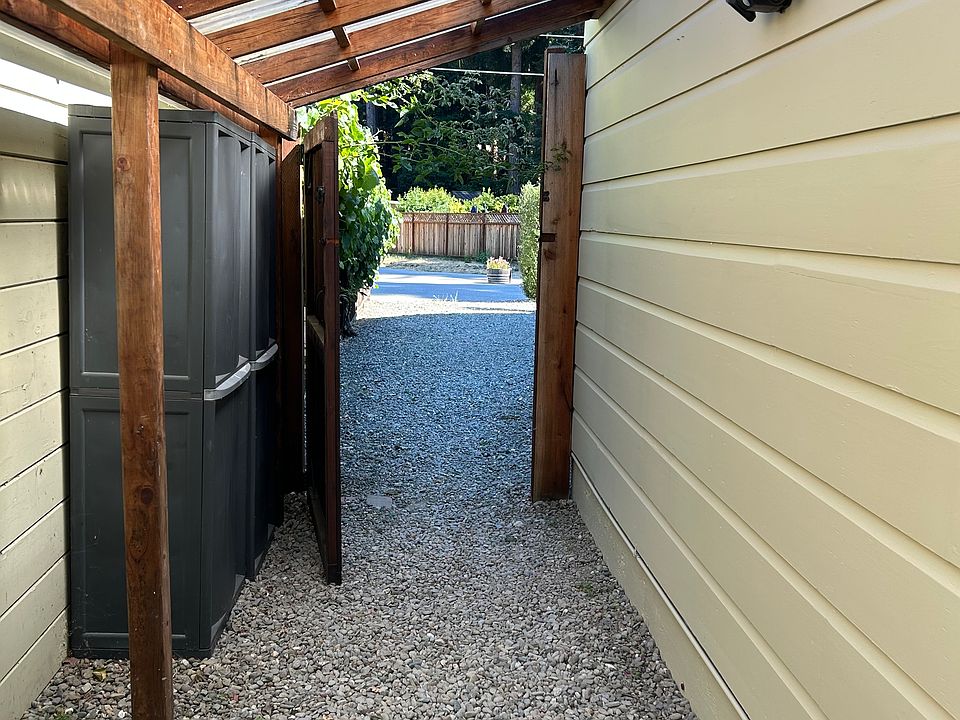 Inside the gate. The second outdoor storage shed is to the left. This shed can fit two bikes and is waterproof.