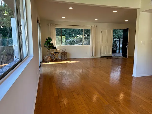 View from dining area to living area towards entry.