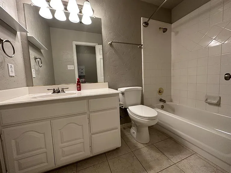 Secondary bath is off the hallway and easy access for guests.
